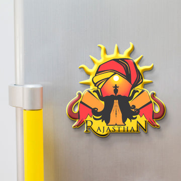 Magnet of Rajasthan with a sun, turban, and elephant on a white background
