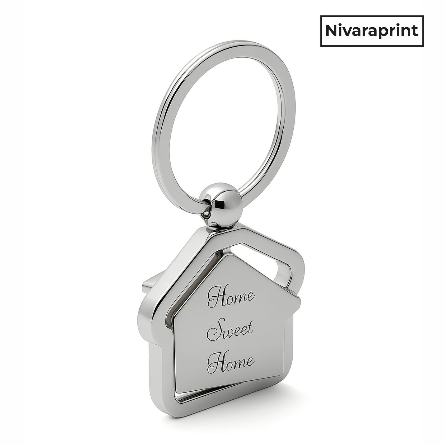 Silver house-shaped keychain with 'Home Sweet Home' engraving on a white background, featuring the brand 'Nivaraprint'.