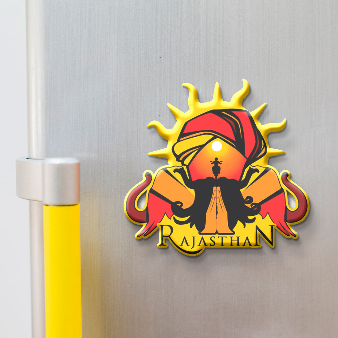 Magnet of Rajasthan with a sun, turban, and elephant on a white background