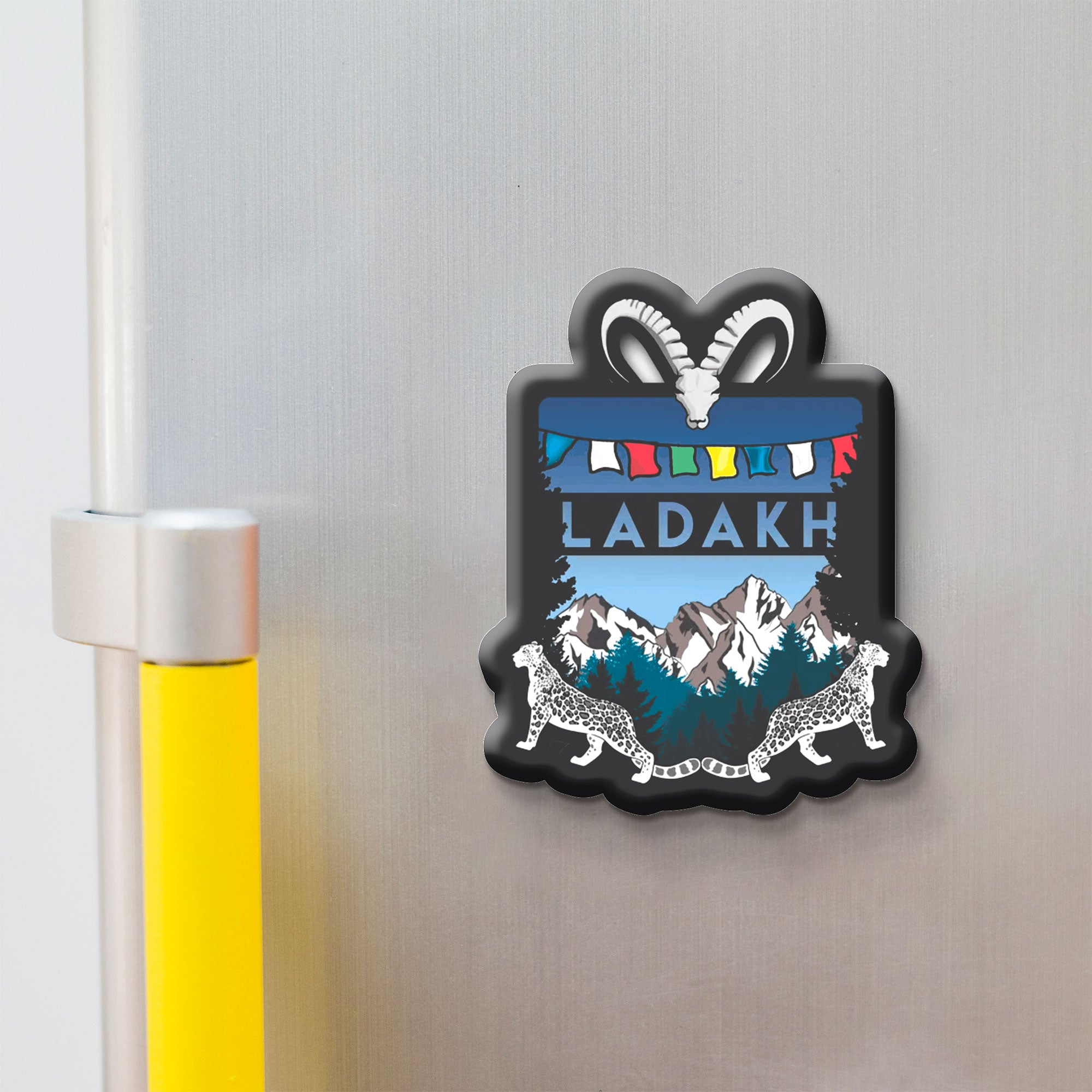 Fridge magnet with 'Ladakh' design on a metallic surface