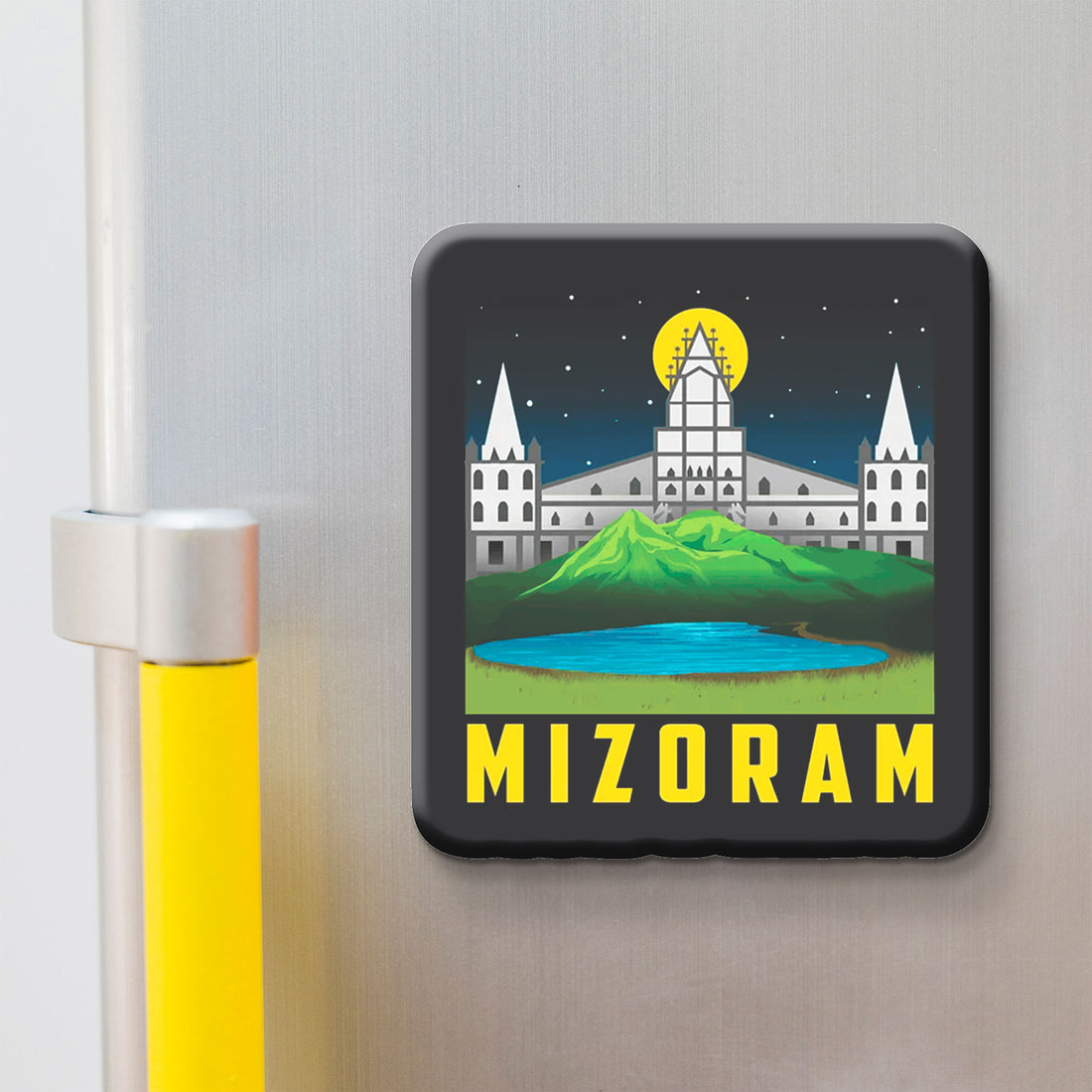 Fridge magnet with a design of Mizo architecture and 'MIZORAM' text on a metallic surface.