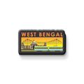 Fridge magnet with 'West Bengal' text and a train design on a metallic surface.