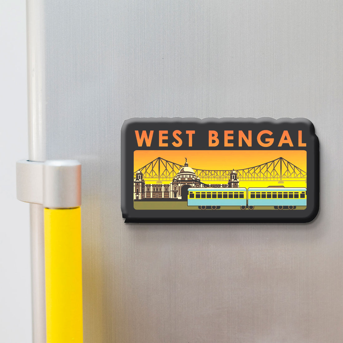 Fridge magnet with 'West Bengal' text and a train design on a metallic surface.