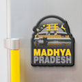 Fridge magnet with 'Madhya Pradesh' text and architectural design on a metallic surface.