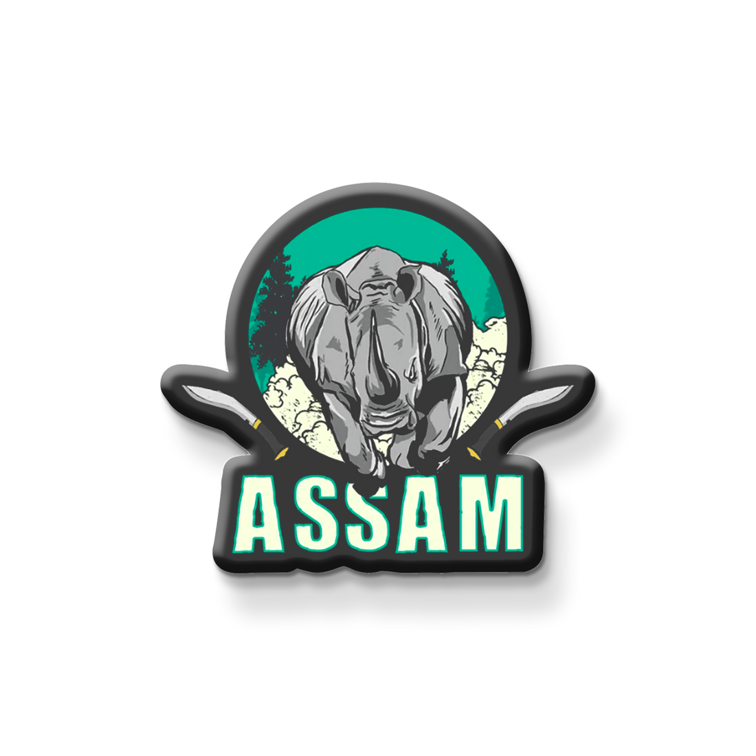 Fridge magnet with a rhinoceros design and 'Assam' text on a metallic surface.