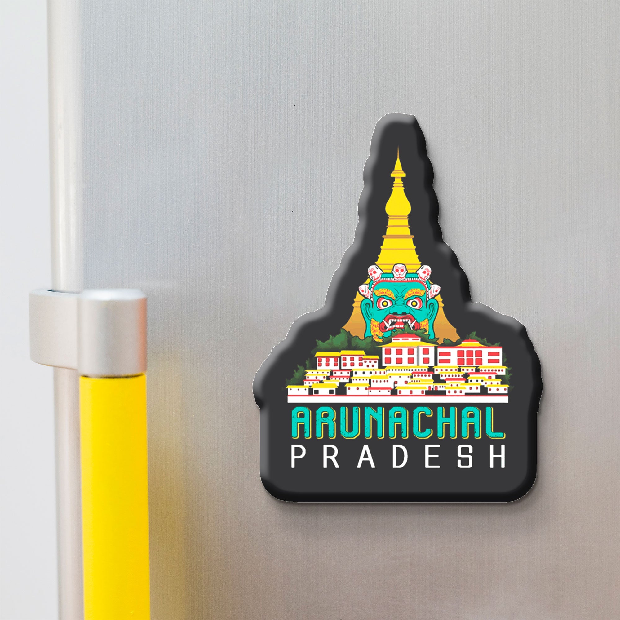 Fridge magnet shaped like Arunachal Pradesh with colorful design on a metallic surface