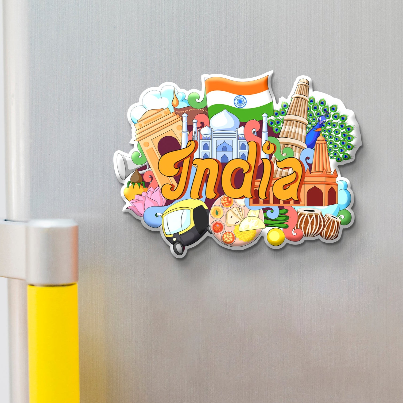 Colorful 'India' magnet with various symbols on a metallic surface