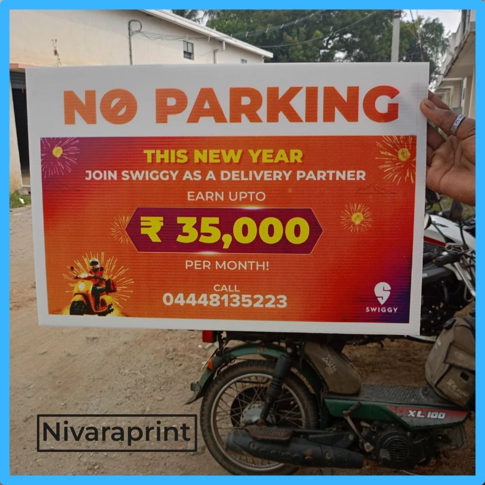Custom No Parking Sunpack sign board with multicolour printing, held outdoors - printed by Nivaraprint